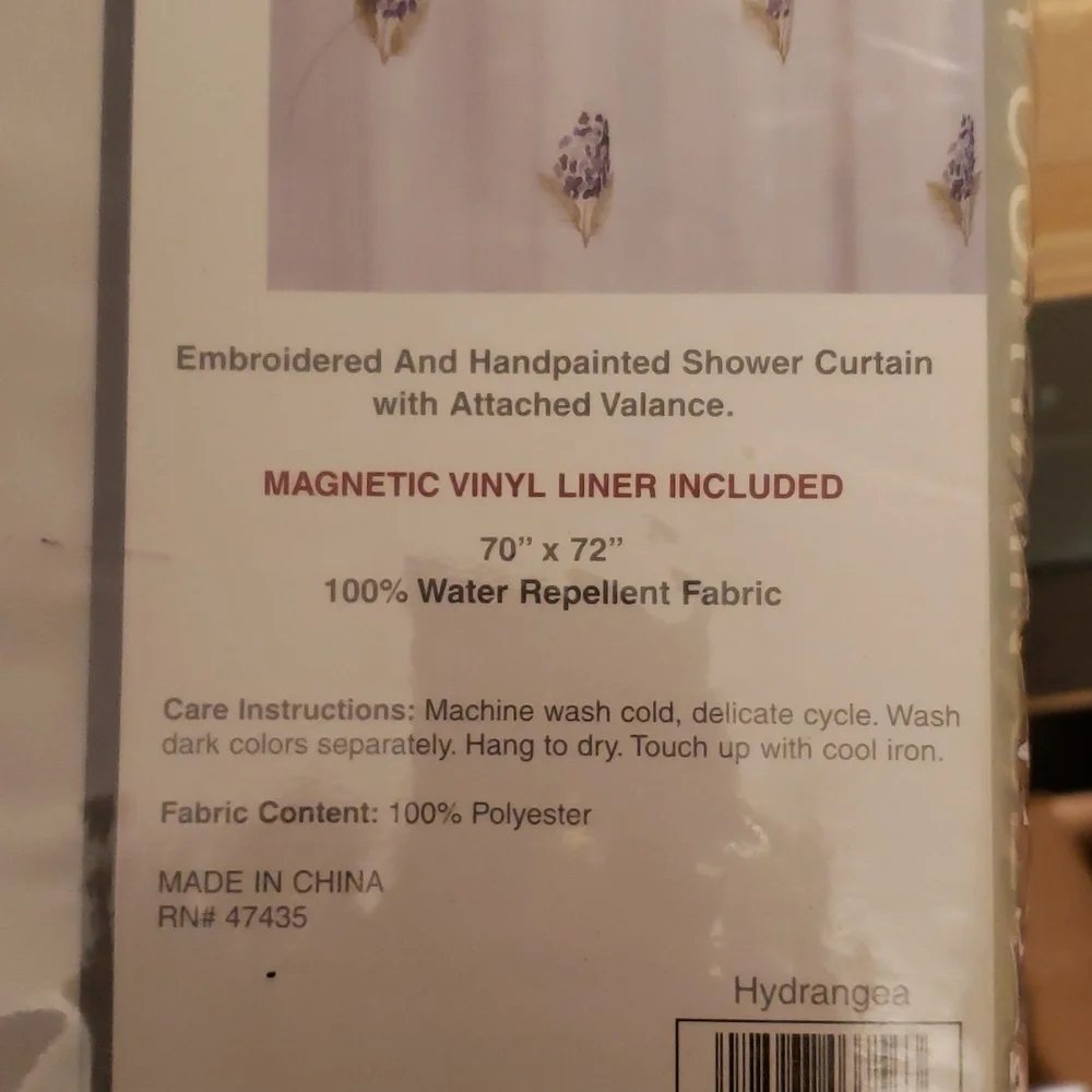 Shower curtain with magnetic liner